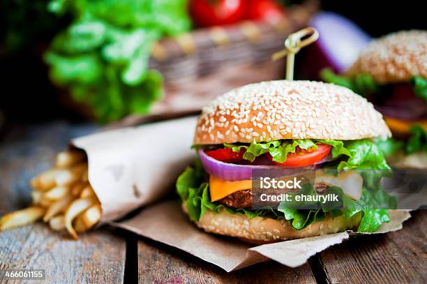 Closeup Of Home Made Burgers On Wooden Background Stock Photo - Download Image Now - Menu, Burger, Hamburger