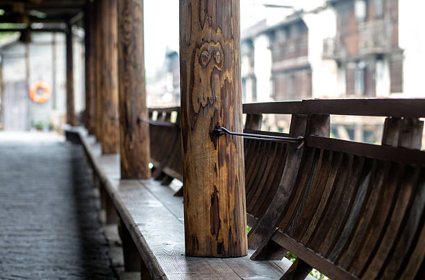 wooden couch and corridor aisle