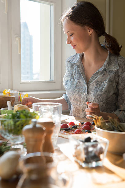 istock Woman cooking pizza at home 466061806