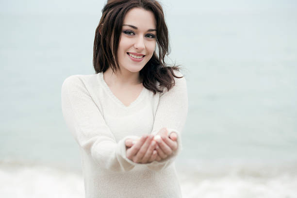 istock smiling girl on the beach 466061923