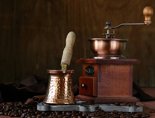 istock copper coffee pot with beans on a wooden table 466062063