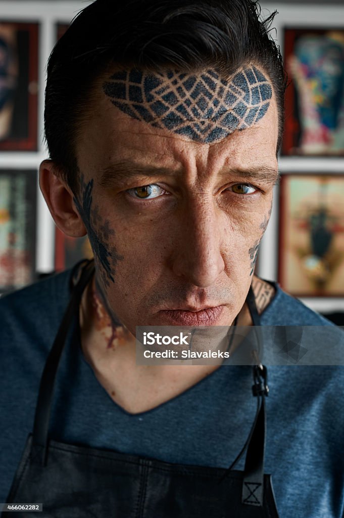 Closeup portrait of tattoo master in studio Closeup portrait of tattoo master in his studio 2015 Stock Photo