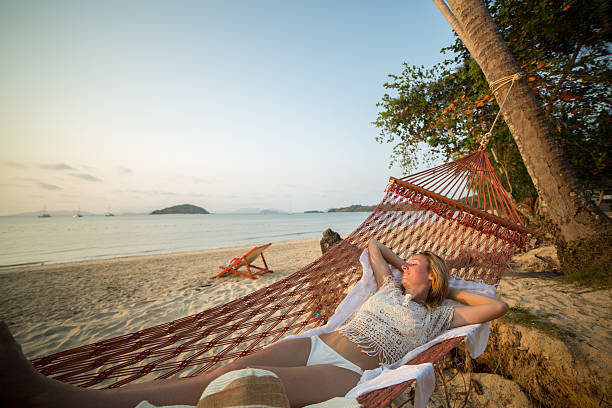 istock Woman relaxing on hammock 466062658