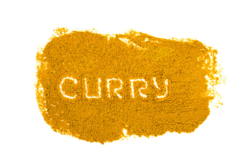 Curry spice isolated on white background