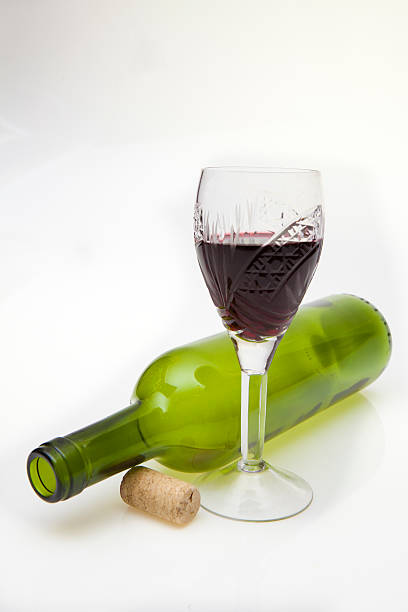 istock Glass of wine and an overturned bottle 466063709