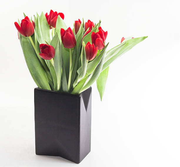 Vase with red tulips stock photo