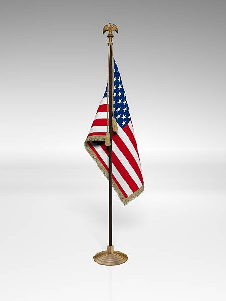 American Flag on stand American Flag on stand, isolated on white background pole stock pictures, royalty-free photos & images