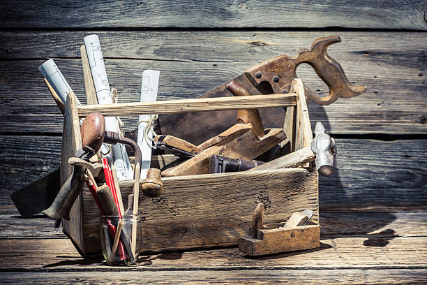 istock Saw, hammer and planer in the carpentry toolbox 466067280
