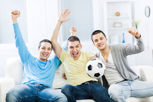 istock Football fans watching a game. 466072959