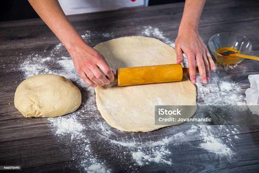 Hands baking dough with rolling pin 2015 Stock Photo