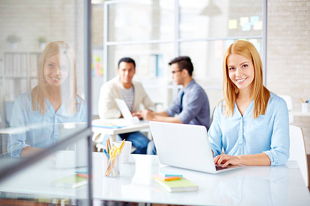 istock Pretty woman in office 466076602