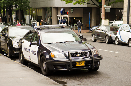 Portland, OR, USA - September 24, 2014:  A Portland Oregon police cruizer or car sits in the downtown area near the courthouse.