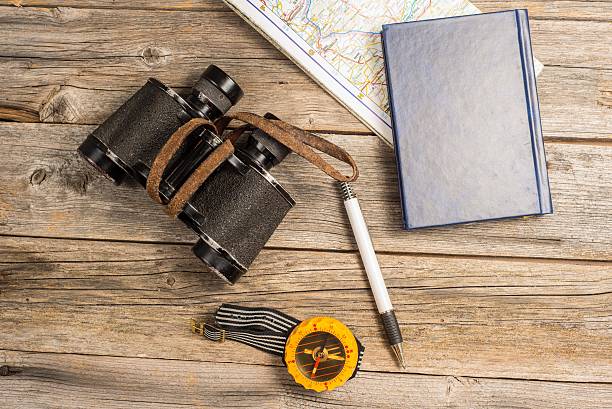 istock Travelers equipment on a wooden table 466077842