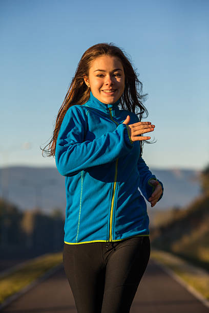 istock Young woman running 466078434