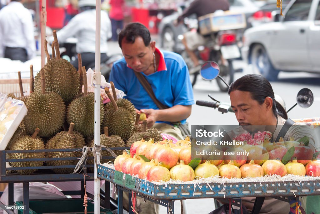 Fruit vendors Bangkok, Thailand-Sep 17th 2012: Fruit vendors waiting for customers. Street vendors can be found all over the city. 2015 Stock Photo