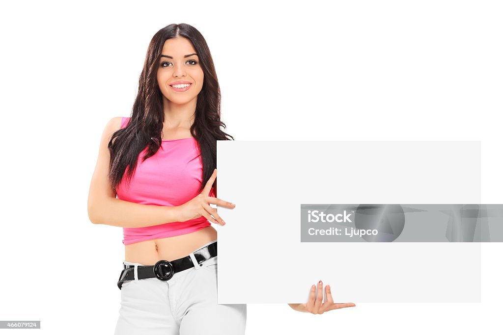 Young woman holding a blank white cardboard Young woman holding a blank white cardboard isolated on white background 20-29 Years Stock Photo