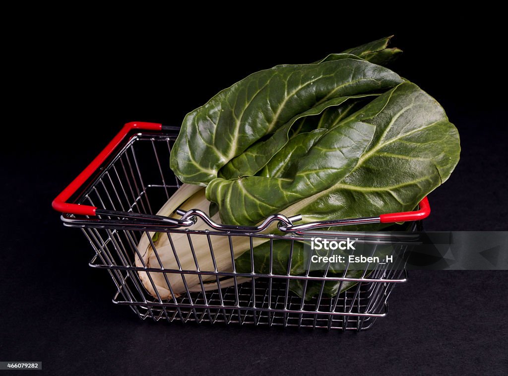 Shopping bag with Mangold Shopping bag with Mangold isolated on Black 2015 Stock Photo
