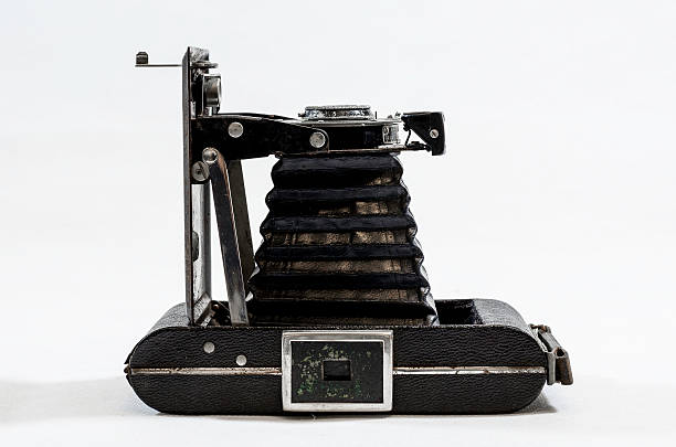 istock vintage bellows camera isolated on white, black and white image 466082514