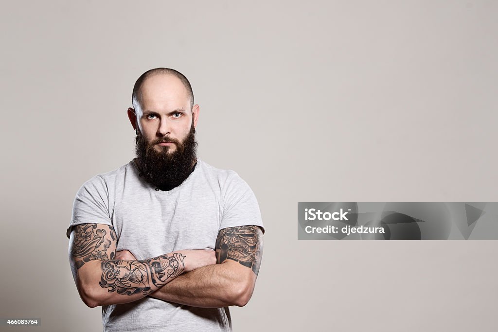 Bearded man with crossed arms Bearded man with crossed arms - studio shot Men Stock Photo
