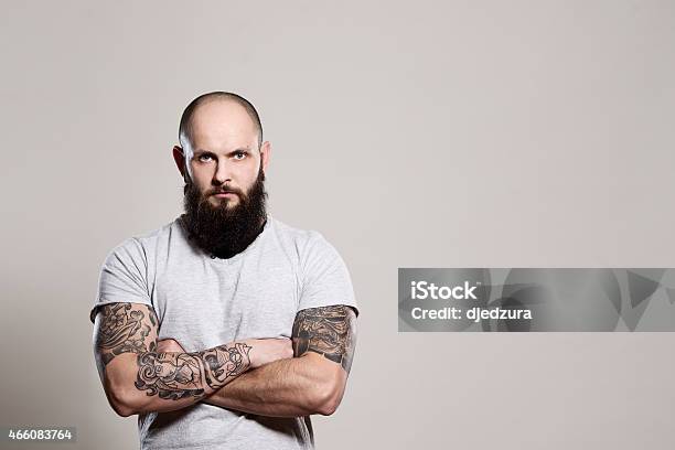 Bearded Man With Crossed Arms Stock Photo - Download Image Now - Men, Tattoo,  Arms Crossed - iStock