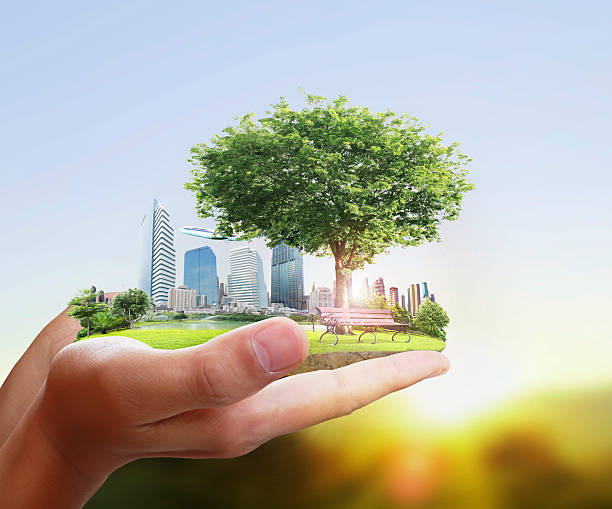 Human holding a city in their hands stock photo