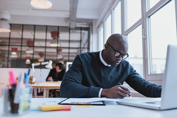 istock Businessman working at his desk with his laptop 466085294