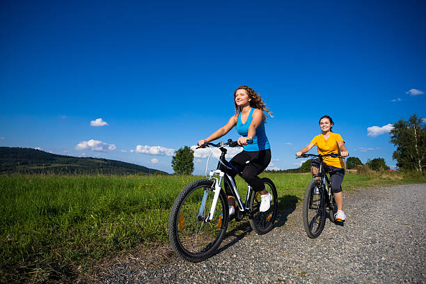 istock Two women riding bike 466085556