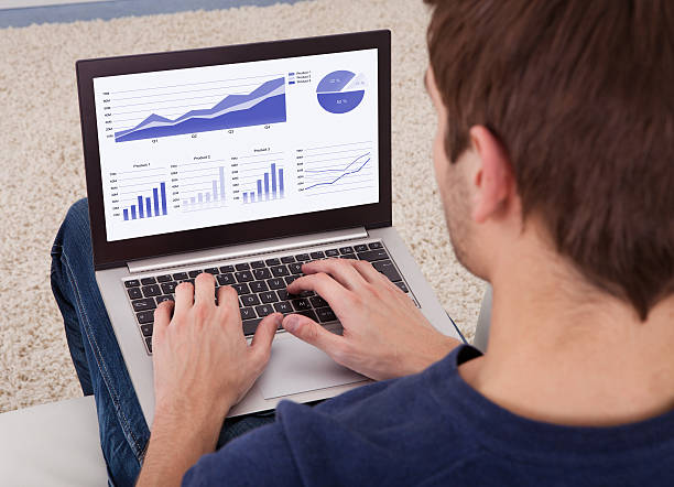 istock Man with a laptop creating a graph of information 466086259