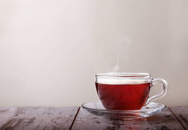 istock Glass cup with tea and a lemon on a glass 466089272