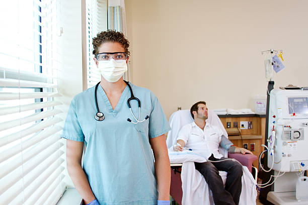 Profile of Renal Nurse with mask on Profile of Renal Nurse in Renal Unit with mask on dialysis photos stock pictures, royalty-free photos & images