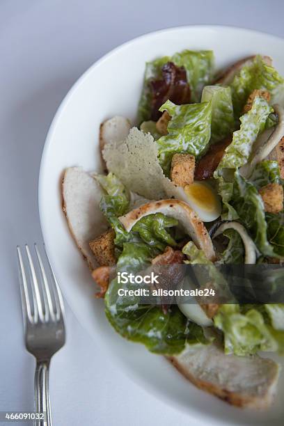 Chicken Caesar Salad With Quails Egg Pancetta And Parmesan Crisps Stock Photo - Download Image Now