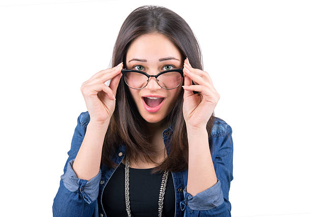 istock surprised girl looking over glasses 466091416