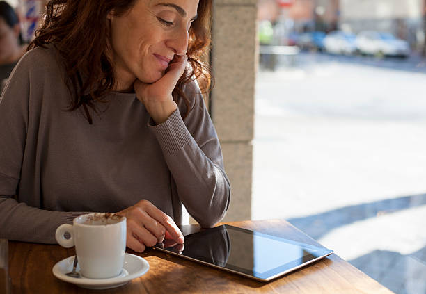 istock woman tablet in cafe horizontal 466093204