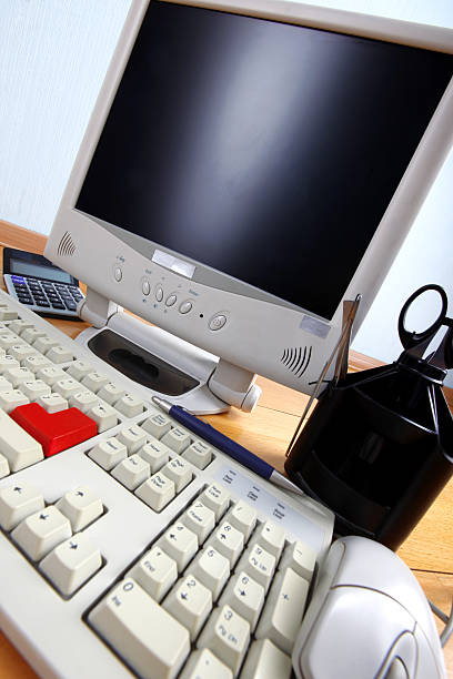 istock classic work place - keyboard and monitor at table 466093680