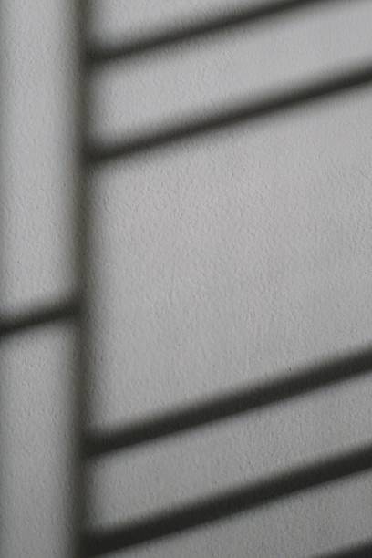 istock shadow of window on the white wall 466093858