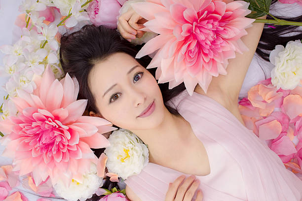 istock girl in flowers sleeping spa 466094156