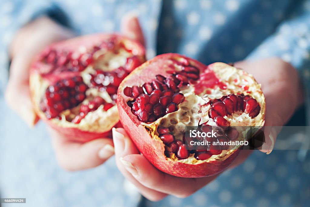 pomegranate woman holding pomegranate Pomegranate Stock Photo