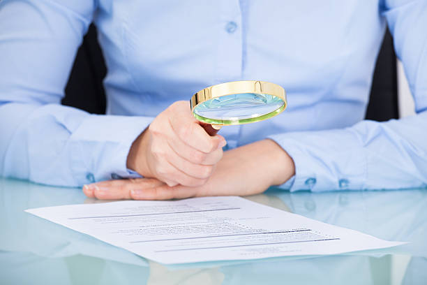 istock Businesswoman Holding Magnifying Glass 466094575