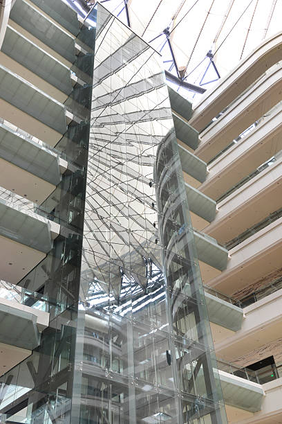 istock Glass elevator in a modern shopping mall 466097265