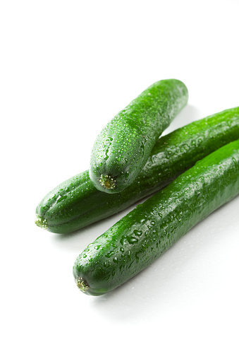 The green cucumbers  on white background