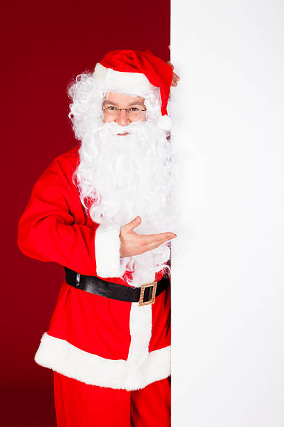 istock Portrait of a santa holding blank placard 466097807