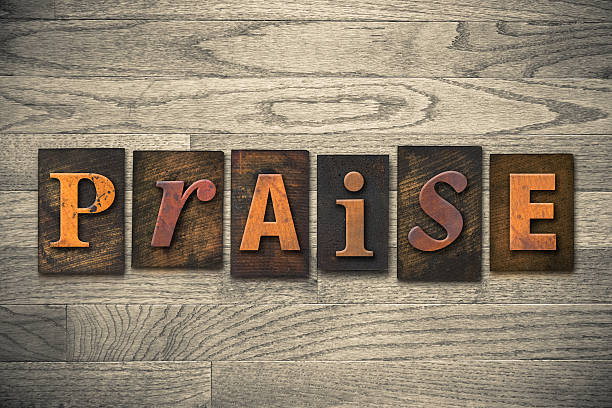 Praise Concept Wooden Letterpress Type The word "PRAISE" written in wooden letterpress type. sing praise stock pictures, royalty-free photos & images