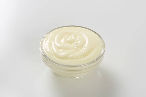 istock Close up of sour cream on white background 466098677