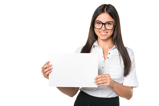Young Woman Holding a Blank White Sign stock photo