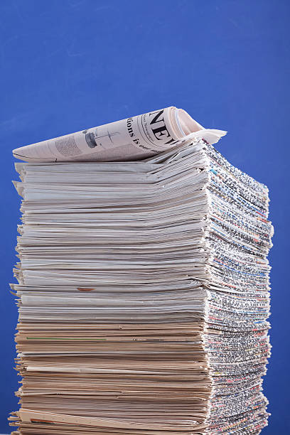 Pile of newspapers on blue background