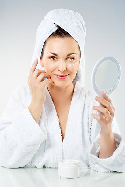 istock applying cream woman 466099815