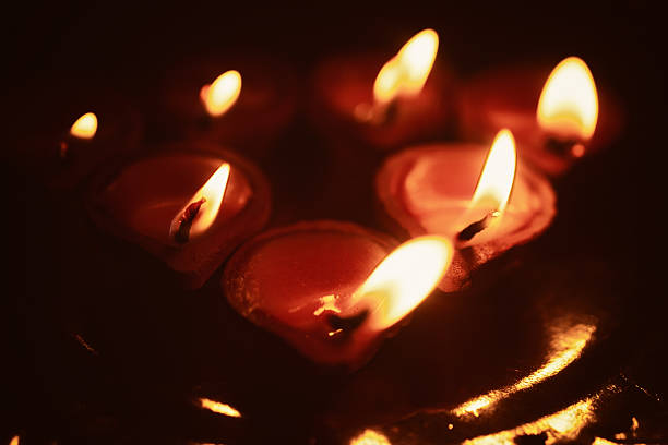 istock small candles in the dark 466100998