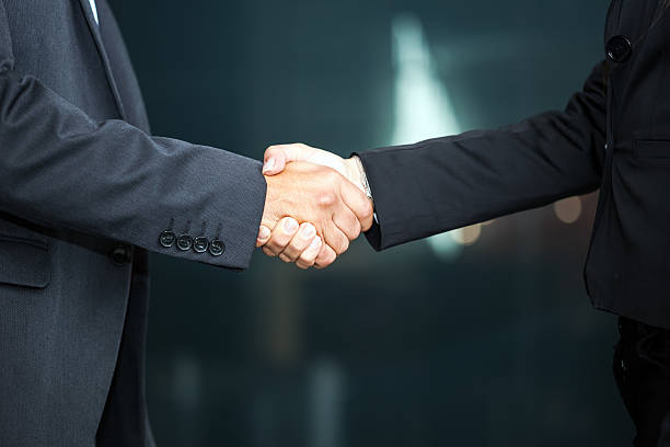 istock Close-up of two businesspeople shaking hands 466101708