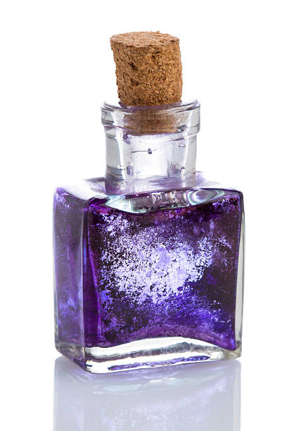 istock Old glass inkwell with dried blue ink isolated on white 466104289
