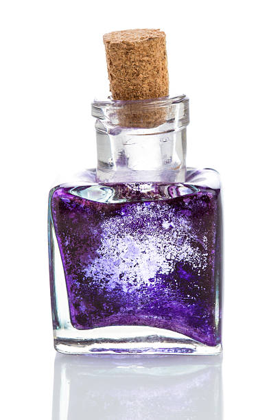istock Old glass inkwell with dried blue ink isolated on white 466104295